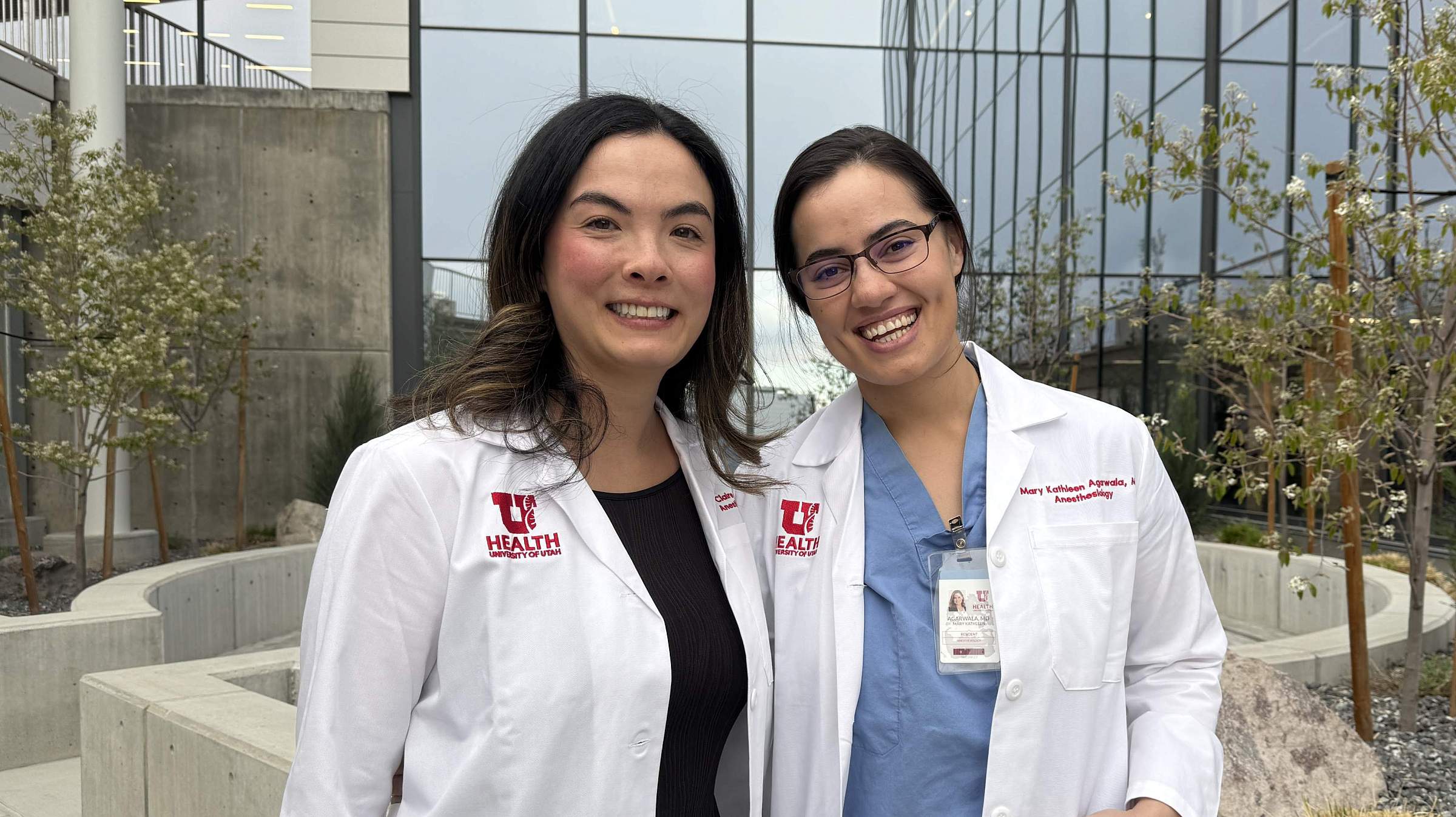 Drs. Claire Lu and Mary Agarwala posing for a photo outside after their Senior Resident Presentation.