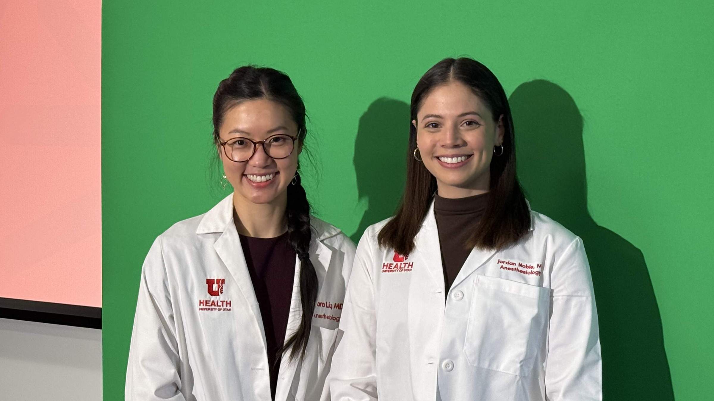 Drs. Flora Liu and Jordan Noble posing for a photo after their Senior Resident Presentation.
